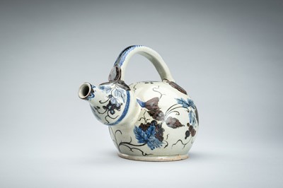 Lot 250 - A CERAMIC POURING VESSEL DEPICTING GRAPEVINES, KENDI