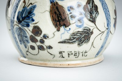 Lot 250 - A CERAMIC POURING VESSEL DEPICTING GRAPEVINES, KENDI