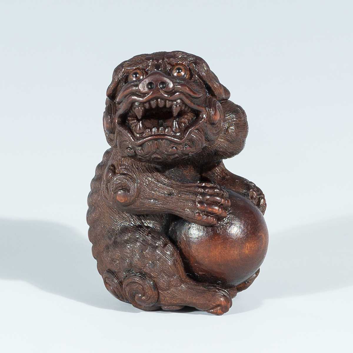 Lot 418 - VADYM PYVOVAR: A BOXWOOD NETSUKE OF A SNARLING SHISHI