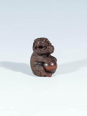 Lot 418 - VADYM PYVOVAR: A BOXWOOD NETSUKE OF A SNARLING SHISHI