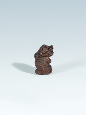 Lot 418 - VADYM PYVOVAR: A BOXWOOD NETSUKE OF A SNARLING SHISHI