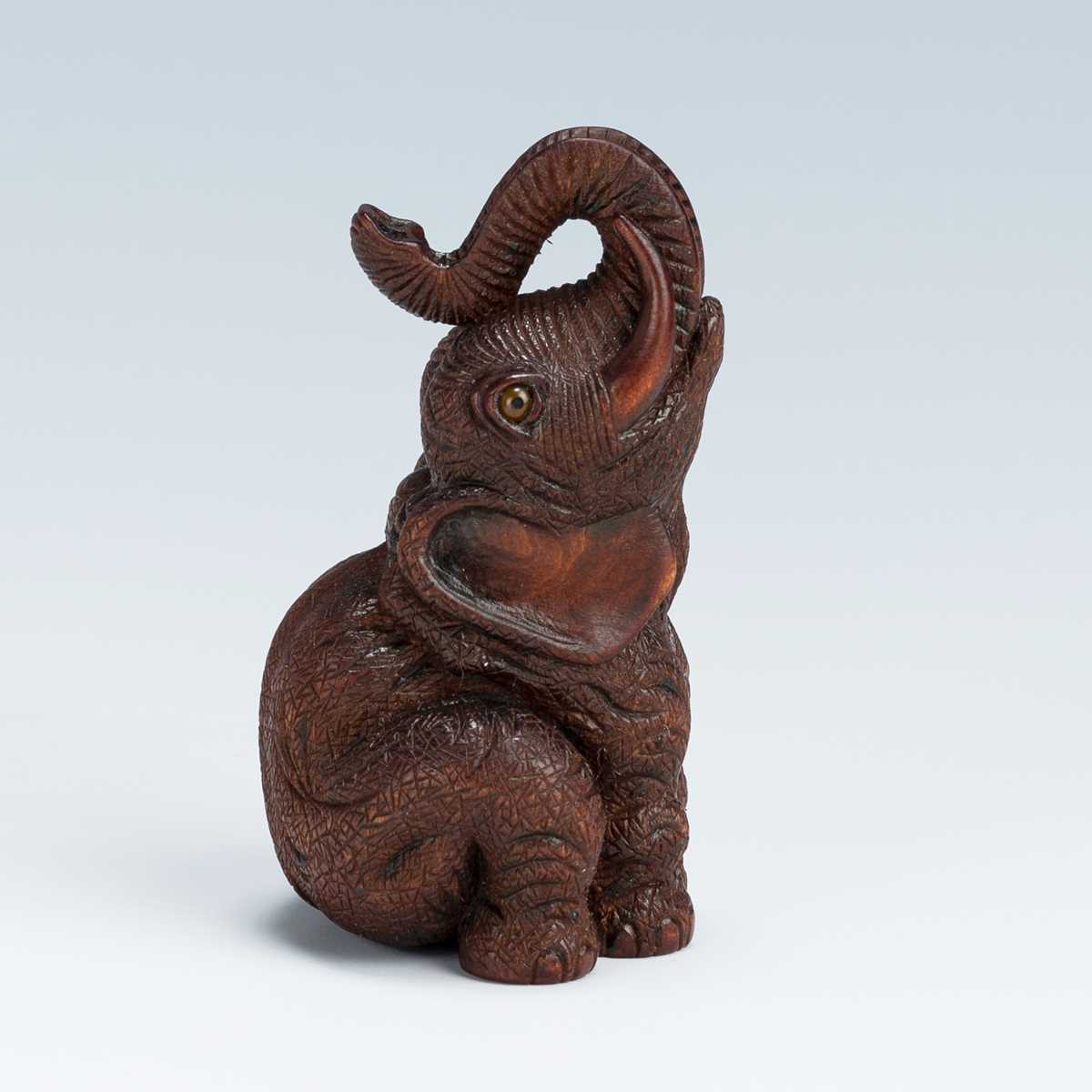 Lot 420 - VADYM PYVOVAR: A BOXWOOD NETSUKE OF AN ELEPHANT, AFTER KOKEISAI SANSHO