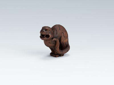 Lot 419 - VADYM PYVOVAR: A BOXWOOD NETSUKE OF A SNARLING TIGER