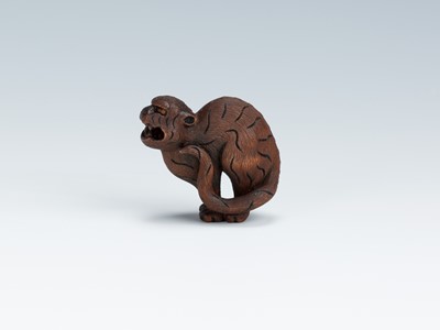 Lot 419 - VADYM PYVOVAR: A BOXWOOD NETSUKE OF A SNARLING TIGER