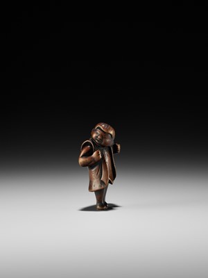 Lot 187 - A RARE WOOD NETSUKE DEPICTING A KARAKO BOY DURING SHICHI-GO-SAN