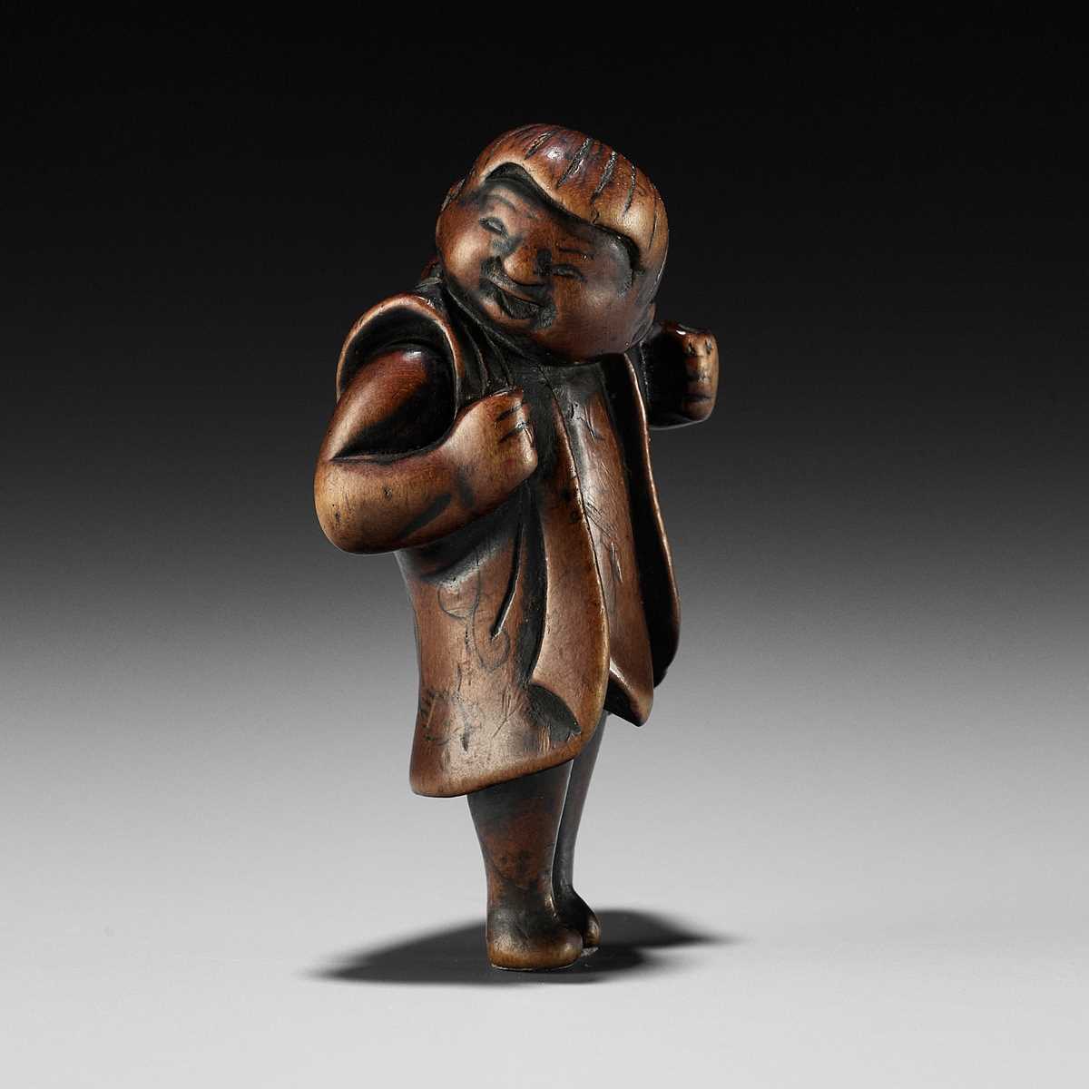 Lot 187 - A RARE WOOD NETSUKE DEPICTING A KARAKO BOY DURING SHICHI-GO-SAN