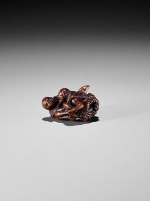 Lot 370 - KOKEI: A FINE WOOD NETSUKE OF AMA STRUGGLING WITH AN OCTOPUS