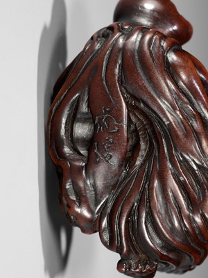 Lot 370 - KOKEI: A FINE WOOD NETSUKE OF AMA STRUGGLING WITH AN OCTOPUS