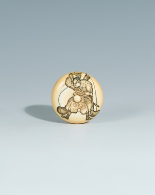 Lot 393 - YOSHITOMO: AN IVORY MANJU NETSUKE OF OTA DOKAN