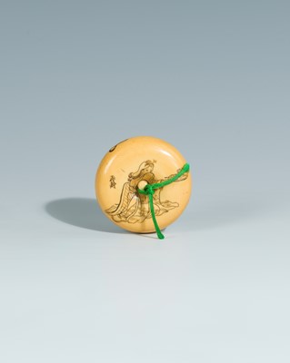 Lot 393 - YOSHITOMO: AN IVORY MANJU NETSUKE OF OTA DOKAN