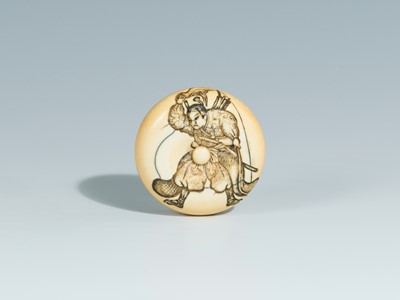Lot 393 - YOSHITOMO: AN IVORY MANJU NETSUKE OF OTA DOKAN