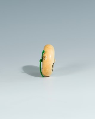 Lot 393 - YOSHITOMO: AN IVORY MANJU NETSUKE OF OTA DOKAN
