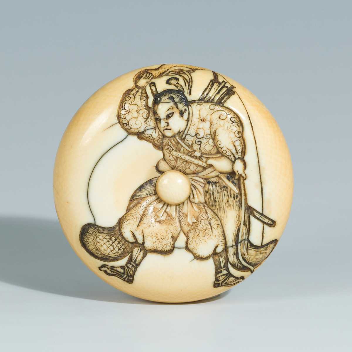 Lot 393 - YOSHITOMO: AN IVORY MANJU NETSUKE OF OTA DOKAN