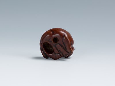Lot 396 - AN OLD WOOD NETSUKE OF A RECUMBENT CAT