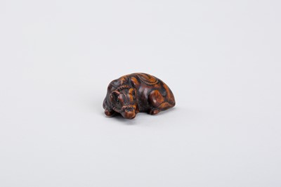Lot 328 - A WOOD NETSUKE OF A RECUMBENT OX