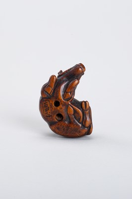 Lot 328 - A WOOD NETSUKE OF A RECUMBENT OX