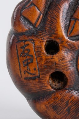 Lot 328 - A WOOD NETSUKE OF A RECUMBENT OX