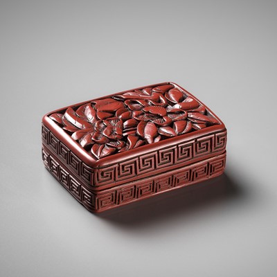 Lot 85 - A CINNABAR LACQUER ‘ORCHID’ BOX AND COVER, EARLY MING DYNASTY