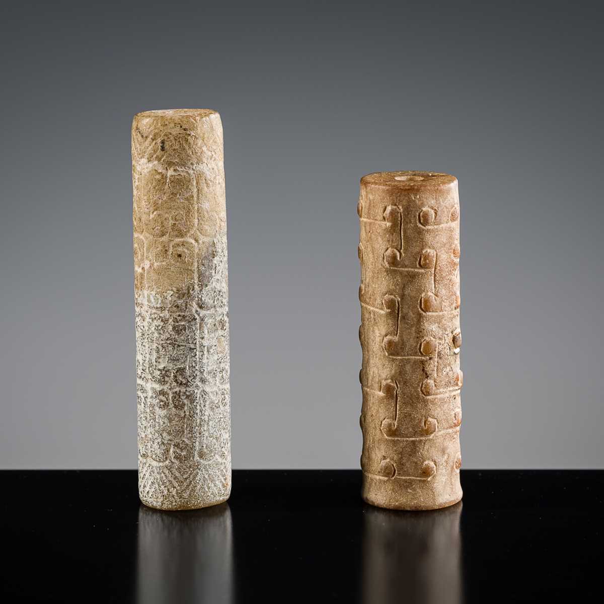 Lot 145 - A GROUP OF TWO ARCHAIC JADE BEADS, EASTERN ZHOU DYNASTY