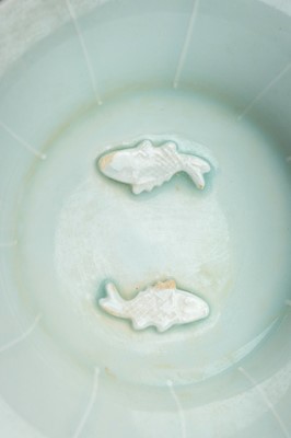 A QINGBAI GLAZED AND MOLDED ‘DOUBLE FISH’ PORCELAIN DISH, SONG STYLE, QING