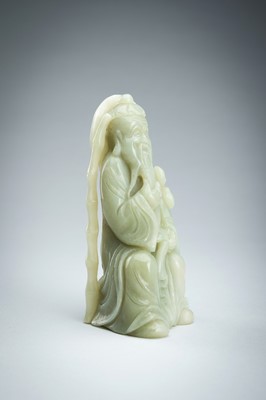 A JADE FIGURE OF AN IMMORTAL WITH FISH, LATE QING DYNASTY
