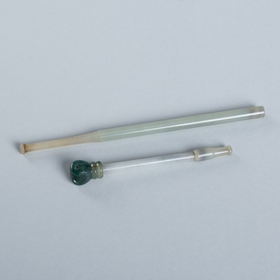 Lot 919 - A GROUP OF TWO JADE CIGARETTE HOLDERS, c. 1920s