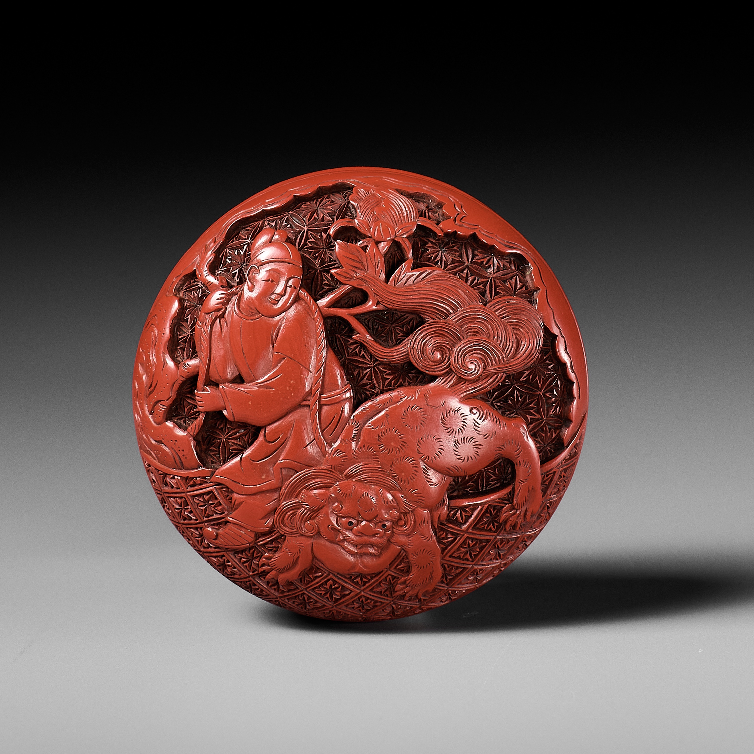 Lot 286 - A FINE TSUISHU (CARVED RED LACQUER) MANJU