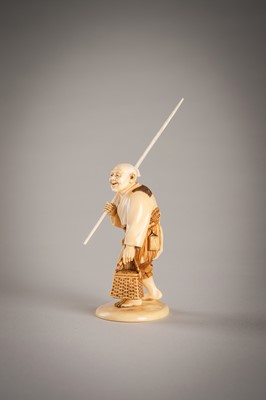 Lot 290 - A FINE IVORY OKIMONO OF A FISHERMAN