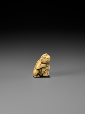 Lot 189 - A FINE OSAKA SCHOOL IVORY NETSUKE OF A MONKEY WITH A SARU MASK