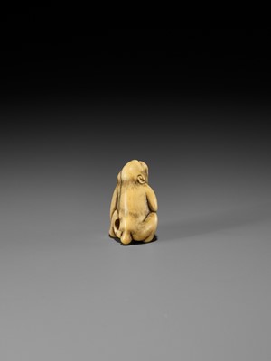 Lot 189 - A FINE OSAKA SCHOOL IVORY NETSUKE OF A MONKEY WITH A SARU MASK