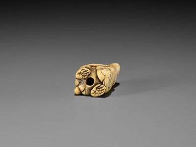 Lot 189 - A FINE OSAKA SCHOOL IVORY NETSUKE OF A MONKEY WITH A SARU MASK