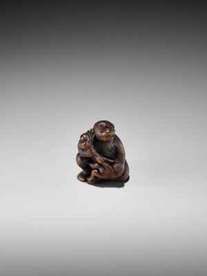 Lot 348 - A HUMOROUS WOOD NETSUKE OF TWO MONKEYS AND PEACH, ATTRIBUTED TO MITSUHARU