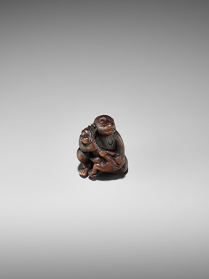 Lot 348 - A HUMOROUS WOOD NETSUKE OF TWO MONKEYS AND PEACH, ATTRIBUTED TO MITSUHARU
