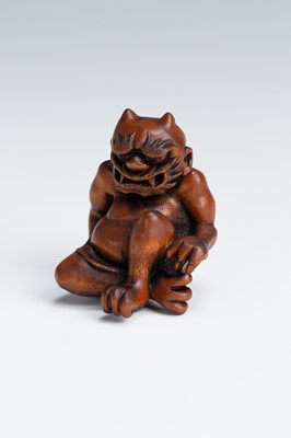Lot 388 - MASAKAZU: A WOOD NETSUKE OF AN ONI SEATED ON A RAT
