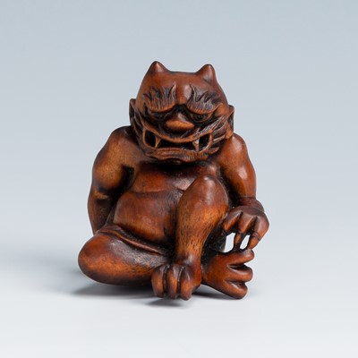 Lot 388 - MASAKAZU: A WOOD NETSUKE OF AN ONI SEATED ON A RAT