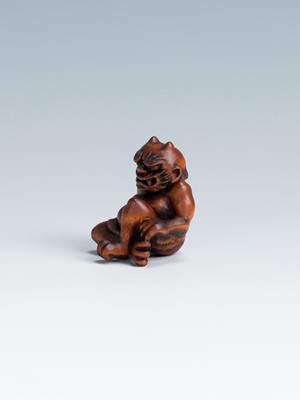 Lot 388 - MASAKAZU: A WOOD NETSUKE OF AN ONI SEATED ON A RAT