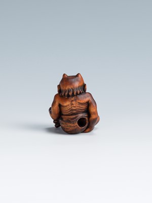 Lot 388 - MASAKAZU: A WOOD NETSUKE OF AN ONI SEATED ON A RAT