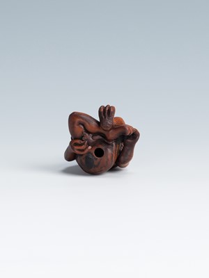 Lot 388 - MASAKAZU: A WOOD NETSUKE OF AN ONI SEATED ON A RAT