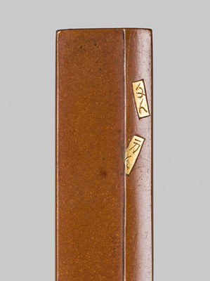 Lot 312 - SHOZUI: A CHARMING HAMANO SCHOOL SUAKA AND SHAKUDO KOZUKA DEPICTING A PILGRIM SIGNING A PILLAR