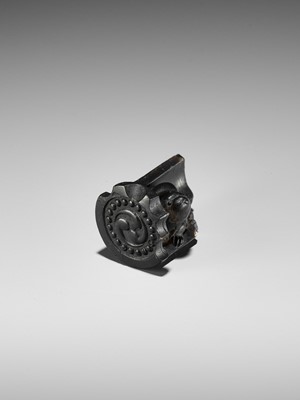 Lot 300 - A RARE HORN NETSUKE OF A PUPPY NESTLED WITHIN A ROOF TILE, ATTRIBUTED TO HORAKU
