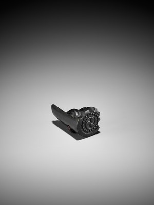 Lot 300 - A RARE HORN NETSUKE OF A PUPPY NESTLED WITHIN A ROOF TILE, ATTRIBUTED TO HORAKU