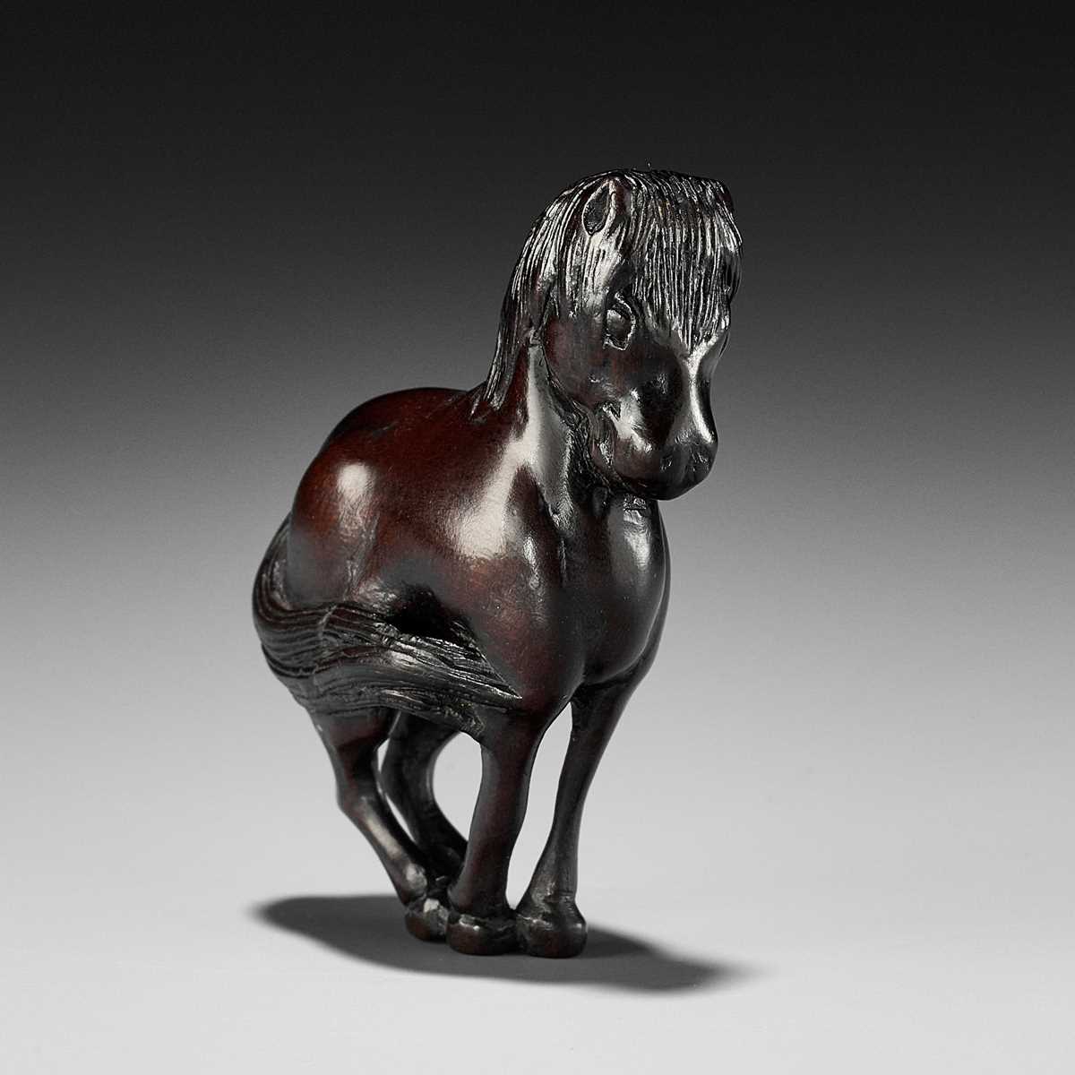 Lot 184 - TSUSEN: A FINE WOOD NETSUKE OF A HORSE