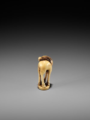 Lot 197 - AN ANTLER INGYO (SEAL) NETSUKE OF A STAG
