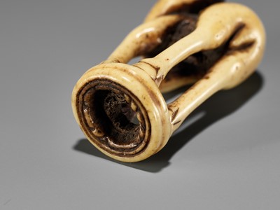 Lot 197 - AN ANTLER INGYO (SEAL) NETSUKE OF A STAG