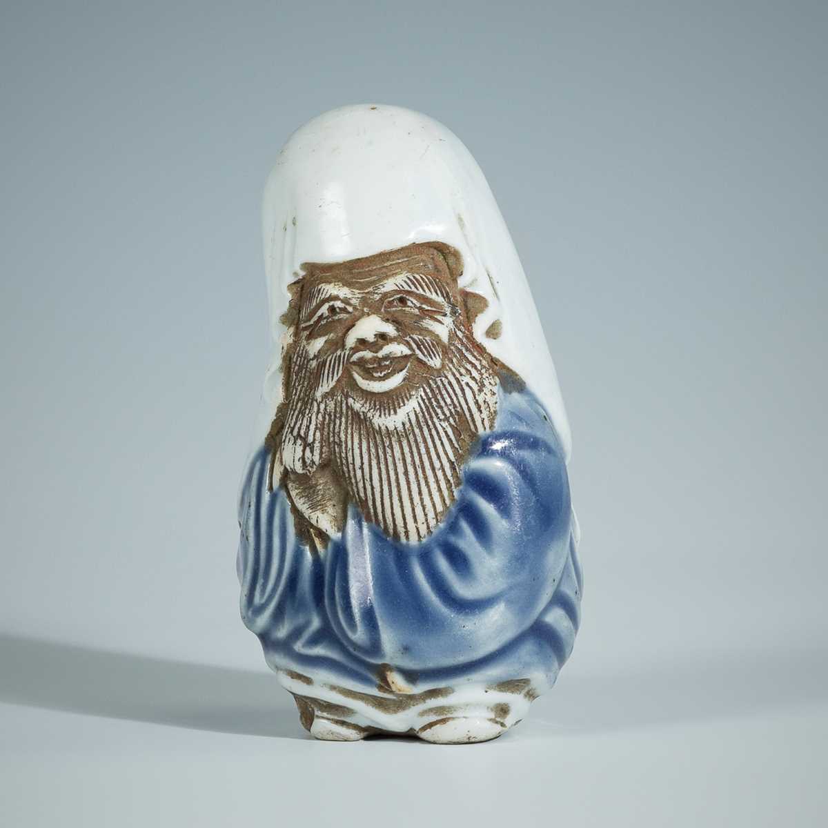 Lot 404 - A FINE HIRADO PORCELAIN NETSUKE OF FUKUROKUJU