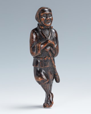 A LARGE WOOD NETSUKE OF A WHISTLING SWEEPER