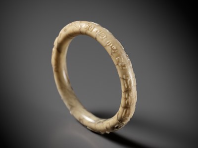 A BLACK AND WHITE JADE BANGLE, MING DYNASTY