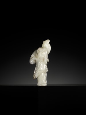 A WHITE AND BLACK JADE FIGURE OF DONGFANG SHUO, SONG TO MING DYNASTY