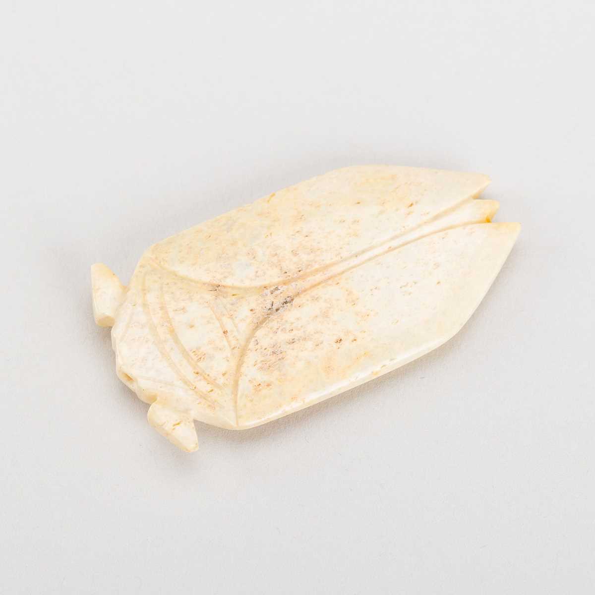 Lot 811 - A JADE TONGUE AMULET IN THE FORM OF A CICADA, HAN DYNASTY