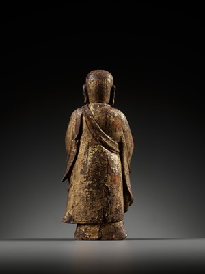 Lot 311 - A GILT-LACQUERED WOOD FIGURE OF ANANDA, YUAN TO MING DYNASTY